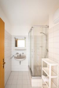 a bathroom with a sink and a shower at Fewo Schneckenhalde App 18 in Bad Säckingen