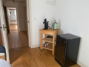 a room with a small table with a coffee maker on it at Frihmess in Bensheim +15 photos
