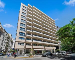 a tall apartment building on a city street at Vilon Recoleta Hotel in Buenos Aires
