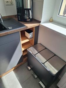 a small kitchen with a refrigerator and a counter at Radlerrast in Weißenfels +9 photos