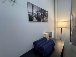 a room with a table with blue pillows on it at Room with Kitchen in Chelsea - Shared Bathroom - 3rd Floor Walk-UP in New York