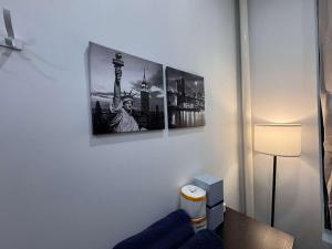 a room with three pictures on the wall at Room with Kitchen in Chelsea - Shared Bathroom - 3rd Floor Walk-UP in New York +11 photos