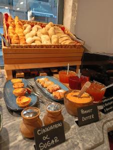 a buffet of pastries and other foods on a table at Dalma Baixa in Lisbon +20 photos