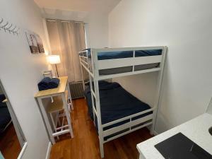 a room with two bunk beds and a desk at Room in Chelsea 2 with Kitchen - Shared Bathroom -5th Floor Walk-UP in New York