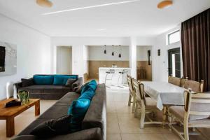 a living room with a couch and a table at Dream House Banja Luka in Banja Luka