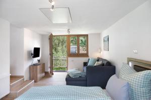 TV a/nebo společenská místnost v ubytování Ferienwohnung Wankblick