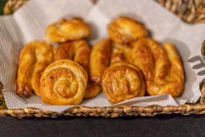 a basket of pastries sitting on a table at Hotel Koncept Residence in Sarajevo