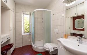a bathroom with a shower and a toilet and a sink at Beach house Lozica by Villas Guide in Dubrovnik +17 photos