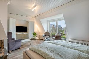 TV a/nebo společenská místnost v ubytování Haus Westsee Og Friesenstil