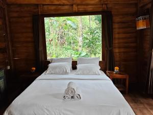 Ένα ή περισσότερα κρεβάτια σε δωμάτιο στο Pondok kepundung