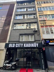 an old city kapatown sign in front of a building at Old City Kadıköy Otel in Istanbul