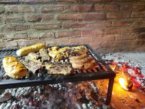 a grill with a bunch of food on it at Hostal Viví La Pampa in Santa Rosa