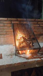 a oven with a fire inside of it at Hostal Viví La Pampa in Santa Rosa
