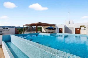 a large swimming pool on top of a building at Blue Wave Hideaway at Quinta Banderas Bay in Bucerías
