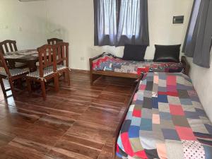 Postel nebo postele na pokoji v ubytování Cabaña El Quebrachal + 14 fotografií