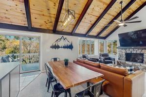 a living room with a table and a couch at The Glen C10 in Sugar Mountain