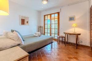 a living room with a couch and a table at Villa La Veleta on Costa Brava in Begur +27 photos