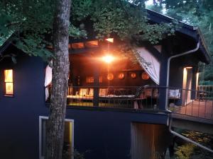 a house with a tree on the side of it at The Loft at Old Falls in Primm Springs