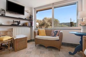 a living room with a couch and a window at Nonna Adele in Sestri Levante