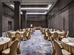 a conference room with tables and chairs in it at Mercure Tangerang BSD City in Tangerang +61 photos