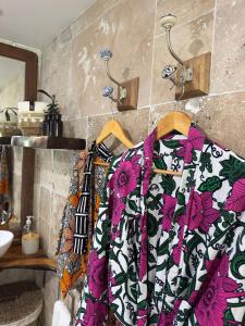 a towel hanging on a rack in a bathroom at Casa Pombo SXM in Anse Marcel 