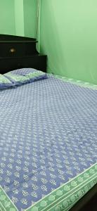 Ένα ή περισσότερα κρεβάτια σε δωμάτιο στο Blissful Homestay