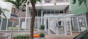 a house with an open front door with a no parking sign at Ap mobiliado reg central de São Paulo in São Paulo