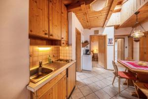 a kitchen with a sink and a counter top at Malgorerhof Pfister in San Genesio Atesino