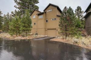 a building with a garage next to a parking lot at Big Pine in Bend