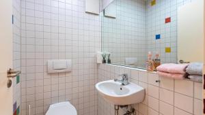 a bathroom with a sink and a toilet at Fewo-Gottmadingen in Gottmadingen +14 photos