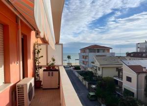 a balcony with a view of a street and buildings at Teresa al Mare in Montesilvano