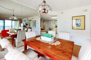 a dining room with a table and chairs at Waikiki #302 in Ocean City