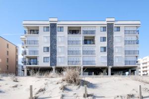 an apartment building on the beach with snow at Waikiki #302 in Ocean City