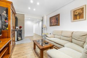 a living room with a couch and a table at La Gimena in Orihuela