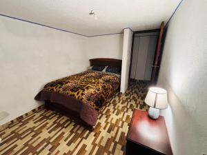 Postel nebo postele na pokoji v ubytování Bachita's apartment