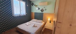 Una cama o camas en una habitación de L'Echappée Belle de Thau 24 fotos más