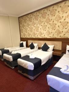 Postel nebo postele na pokoji v ubytování فندق لؤلؤة الجوار مكه