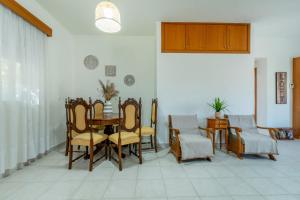 a dining room with a table and chairs at Mike's House in Kremasti near the Beach Rhodes in Kremasti