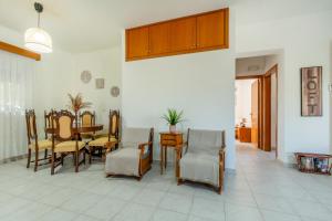 a dining room with a table and chairs at Mike's House in Kremasti near the Beach Rhodes in Kremasti