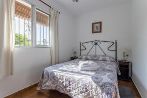 Postel nebo postele na pokoji v ubytování Cortijo Encarni + 17 fotografií