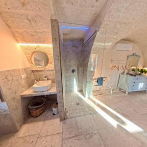 a bathroom with a shower and a toilet and a sink at Al Palazzotto in Fasano +49 photos