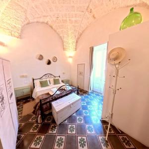 a bedroom with a bed and a tiled floor at Al Palazzotto in Fasano +63 photos