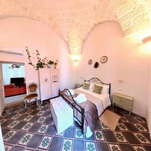 a bedroom with a bed in a room at Al Palazzotto in Fasano