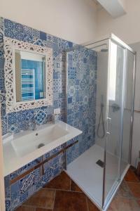 a bathroom with a sink and a shower at Il Timo in Marciana