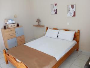 Ένα ή περισσότερα κρεβάτια σε δωμάτιο στο Pantokratoras Sunset