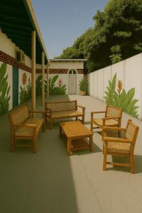a rendering of a patio with benches and a table at Açaizeiro Hostel in Belém