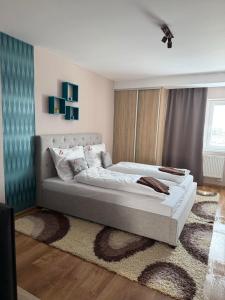 Ένα ή περισσότερα κρεβάτια σε δωμάτιο στο Mimi Apartment