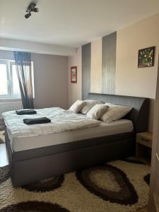 Ένα ή περισσότερα κρεβάτια σε δωμάτιο στο Mimi Apartment