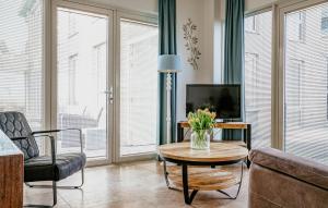 a living room with a couch and a table at Flat Fish in Egmond aan Zee