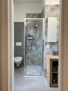 a bathroom with a shower and a toilet at La Terrazza di Luca in Tavernelle +39 photos